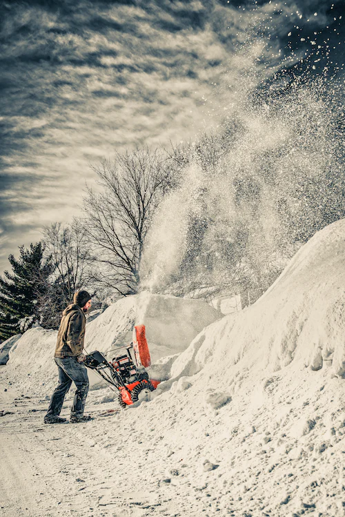 man with snow blower